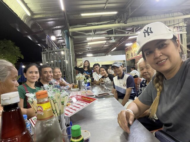 Volunteers distributing food packages to families in need