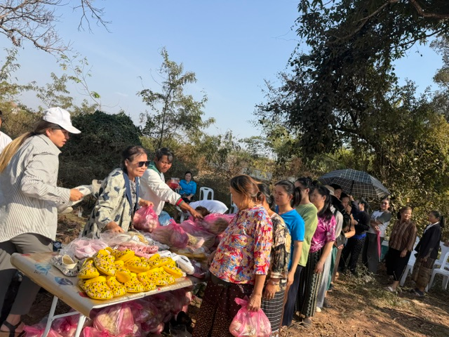 Community members selecting clothing at our distribution center